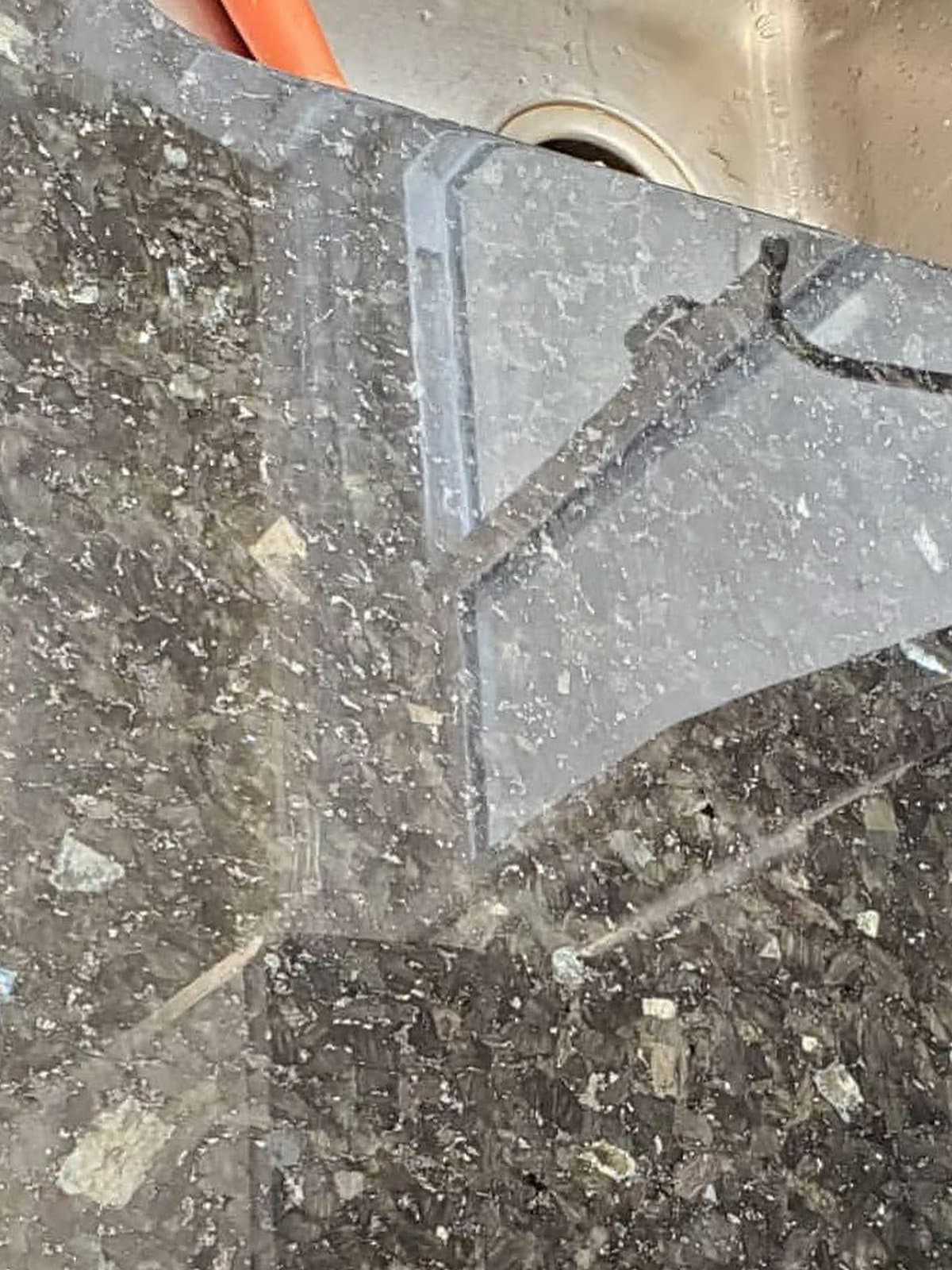 The same countertop polished back to a deep gloss