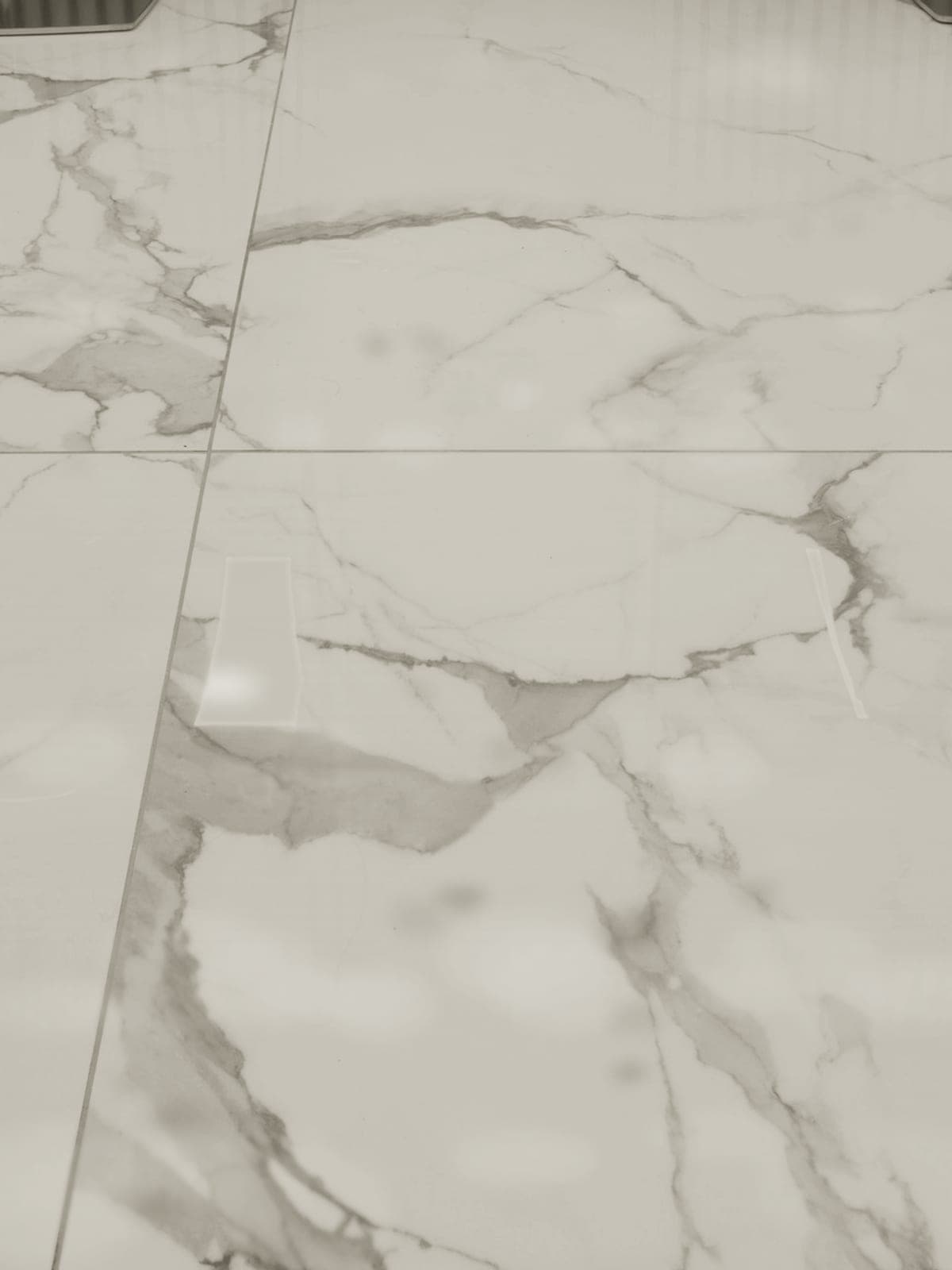 Tile floor with darkened, uneven grout lines before cleaning