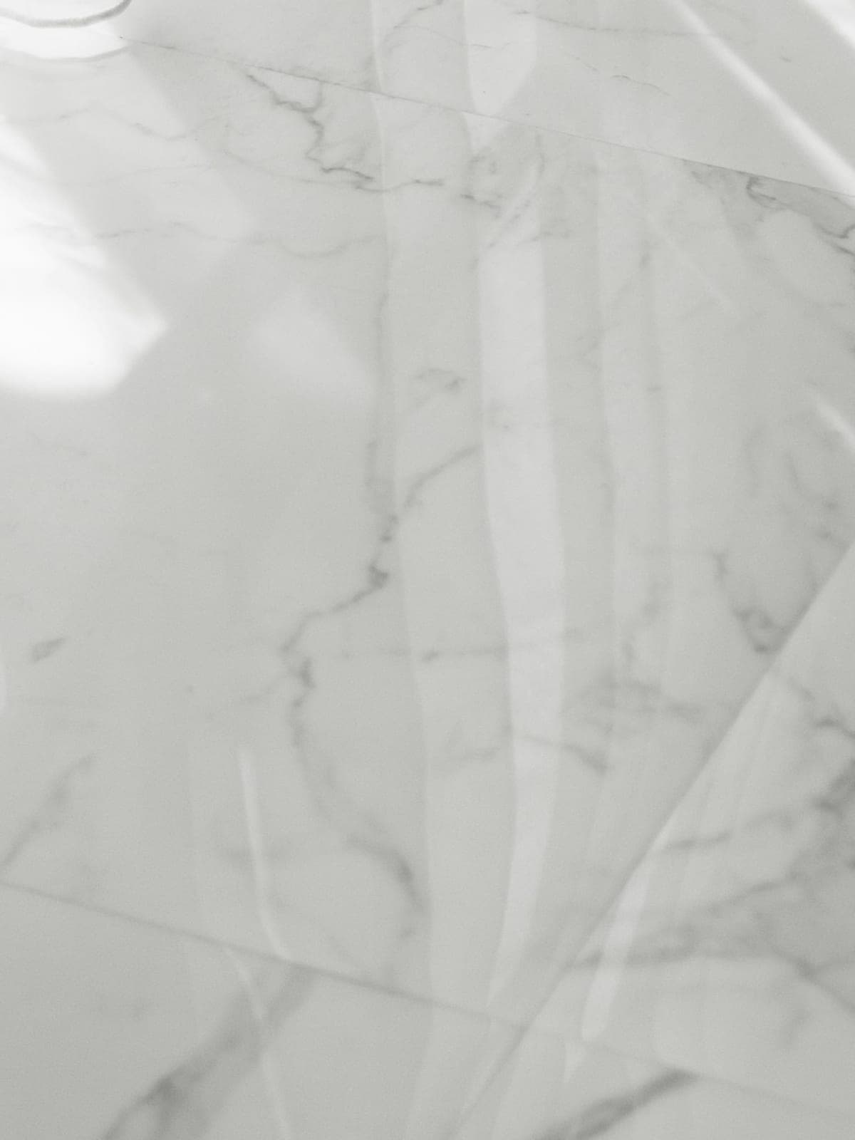 The same marble floor polished to a clear reflection