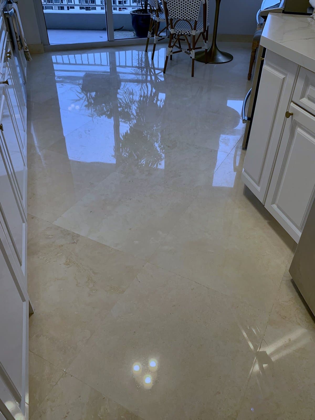 The same kitchen floor polished to a clear reflection