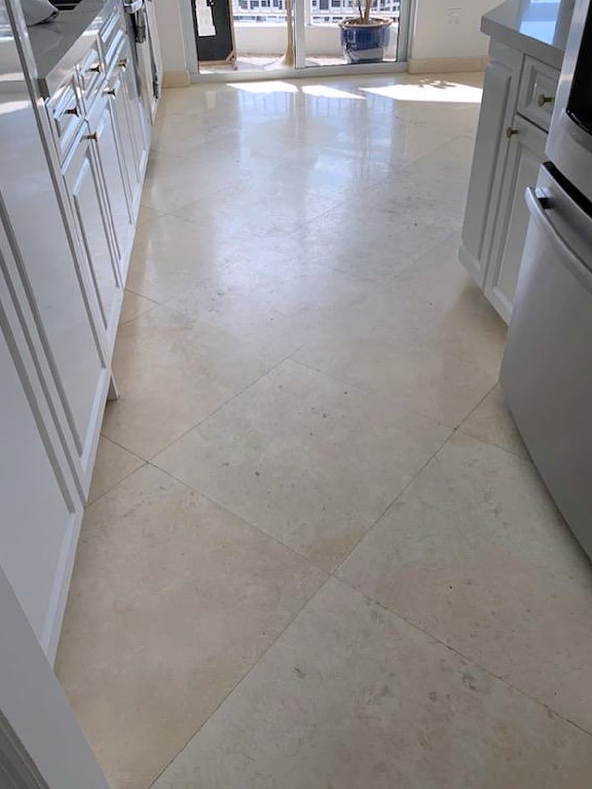 Dull marble kitchen floor before restoration