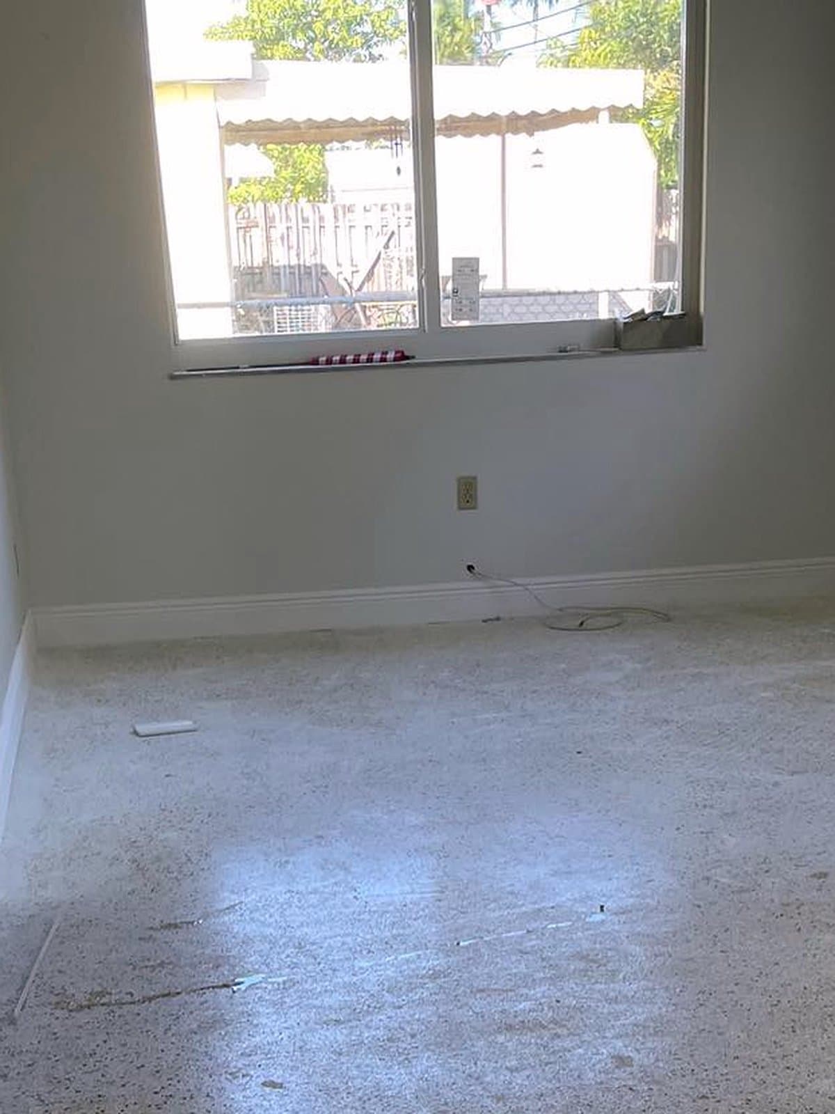 Dull, stained terrazzo floor before restoration